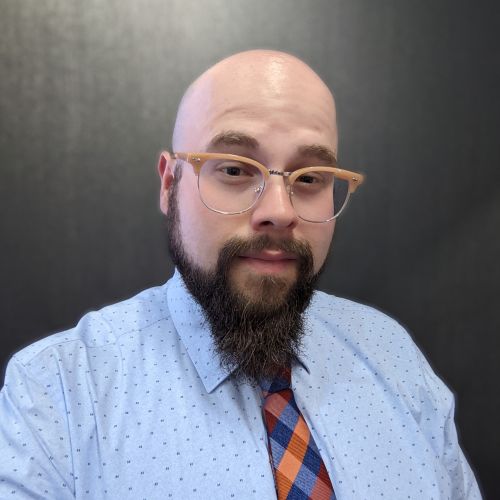a headshot of Phil Traversa wearing business professional attire